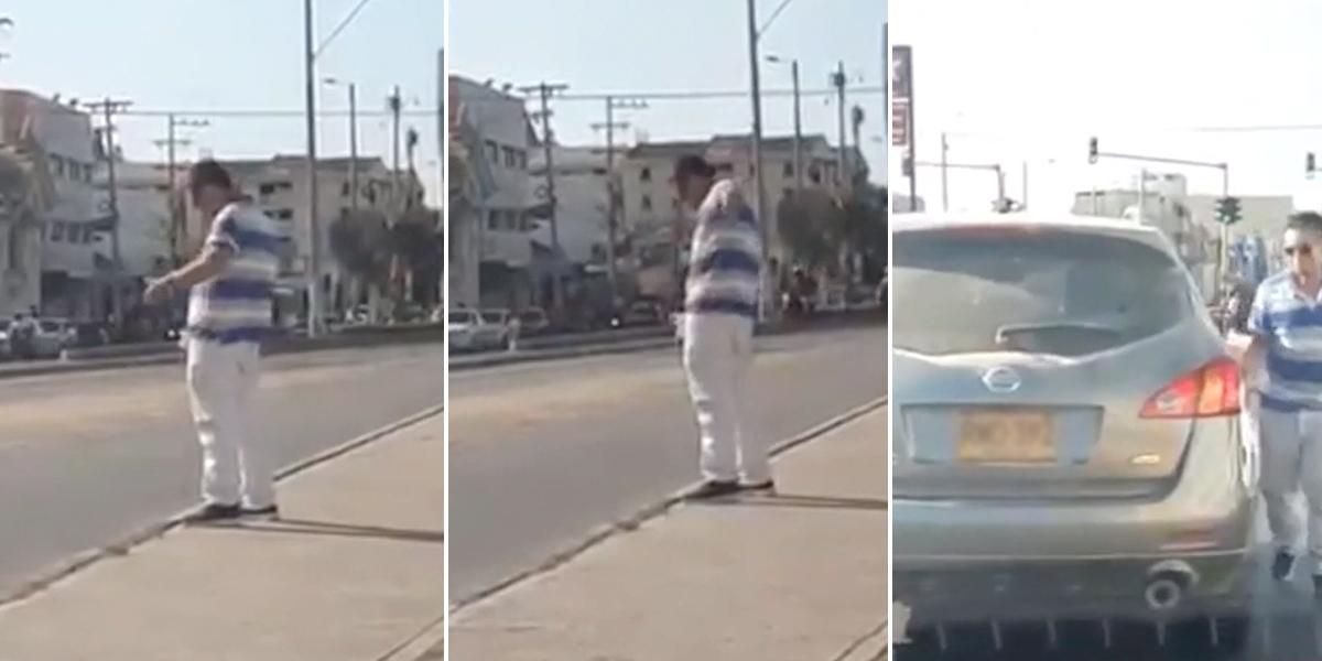 En plena vía pública y provocando trancón, a un hombre se le ocurre parar a orinar en Cartagena